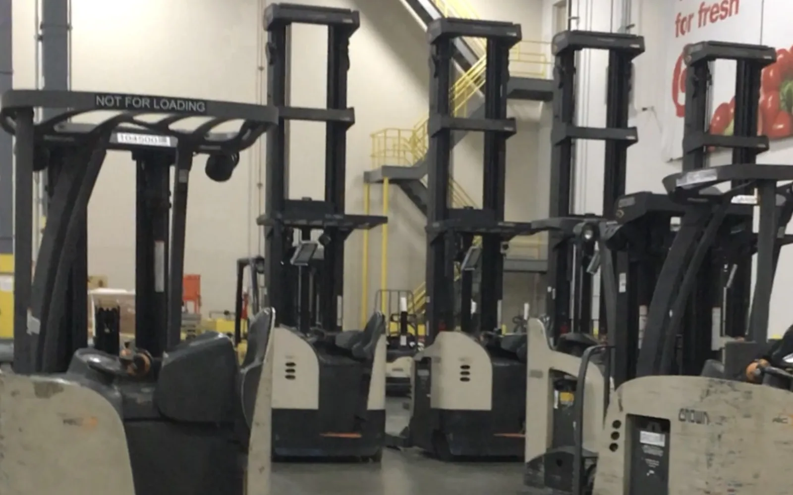 Interior of a large modern warehouse facility with storage racks and logistics infrastructure
